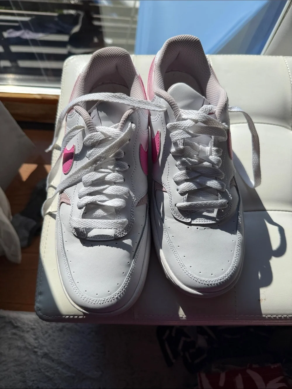 Nike Women's White Sneakers with Pink Swoosh